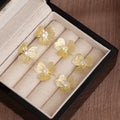 Gold and Silver Triple Four Petal Dangle Flower Earrings view 6