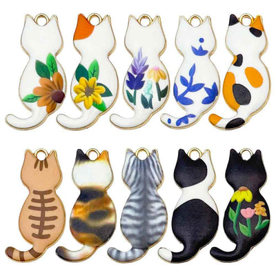 Colorful cat charms arranged on a light background