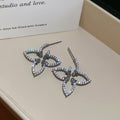 Open Flower Outline Stud Earrings in Gold and Silver view 6