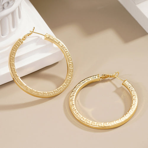 Gold Greek Key Hoop Earrings Polished Statement Fashion Jewelry shown in a styled view