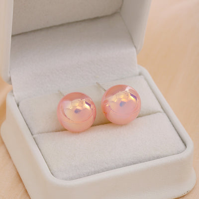 Primary supplied view of pink iridescent pearl-look studs