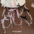 Long Pearl Strand Necklace With Crystal Bow Accents view 3