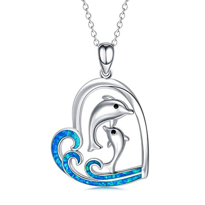 Front view of dolphin heart pendant with blue wave detail