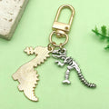 Dinosaur Metal Keychains In Six Colorful And Silver-Tone Styles view 4