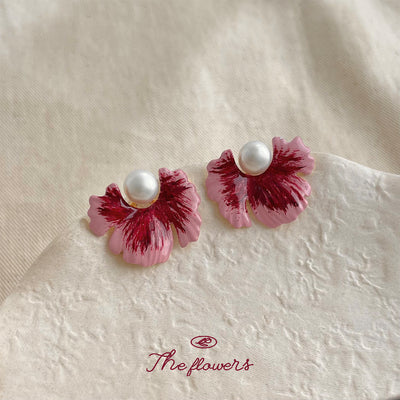 Pink magenta painted petal studs with pearls on cream fabric