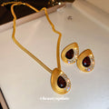 Gold Tone Red Teardrop Necklace and Stud Earrings with Polished Metal Accents view 3