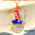 Pearl Loop Mini Mermaid Keychains in Three Sitting and Reclining Poses view 7