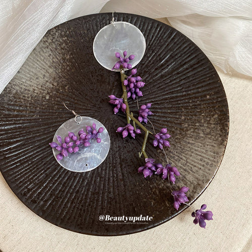 不对称紫花圆片流苏耳环 shown in product image 2, with the pictured color, shape, and construction details