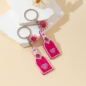 Pink Beaded Bottle Charm Keychain With Flower Bead Accent