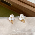 White Enamel Flower Stud Earrings Gold Leaf Accent Pair view 3