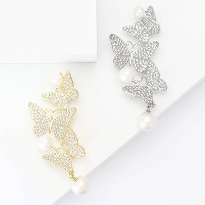 Gold and silver triple butterfly pearl dangle brooches together