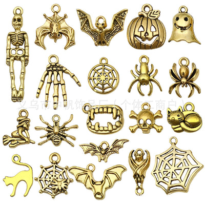Matte gold-tone assorted shape charms arranged on a light background