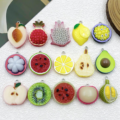 Multicolor strawberry charms arranged on a light background