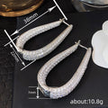 Crystal Pave Teardrop Huggie Earrings With Clear Stone Accents view 4