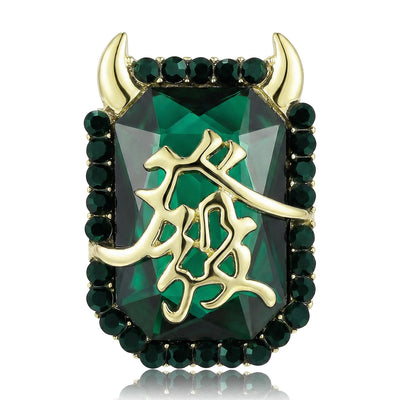 A dark green rectangular brooch with a gold-tone Chinese character shown on a white background