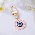 Gold Tone Enamel Lash and Crystal Evil Eye Clip Keychains view 4