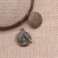 Antique Bronze Cake Slice Pendant Charm in Round Frame view 2