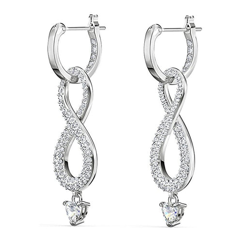 Pair of white gold infinity pave earrings with heart clear drops