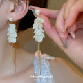 White Petal Cluster Drop Earrings with Long Gold Tone Tassels view 1