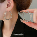 Twisted Double Hoop Earrings in Gold and Silver Tones view 3