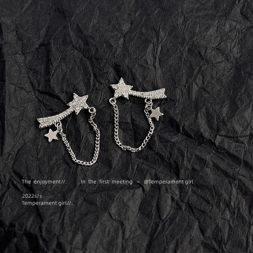 Silver crystal shooting star chain studs on black crumpled paper