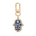 Twelve Piece Gold Tone Owl Heart Butterfly Evil Eye Keychain Set view 4