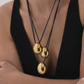 Oval Drop Pendant Black Cord Necklace in Two Metal Tones view 3