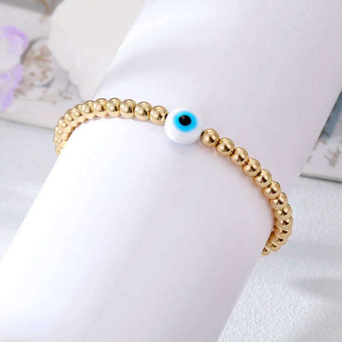 Gold Tone Beaded White Blue Evil Eye Stretch Bracelet