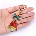 Red Textured Bell Keychain Gold Rim Pearl Teal Bow view 3