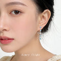 Silver Tone Aqua Stone Planet Orbit Long Stud Earrings view 2