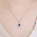 Silver Tone Blue Oval Cabochon Floral Halo Pendant Necklace view 3