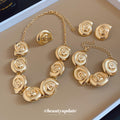 Gold Spiral Shell Necklace Bracelet Earrings and Ring view 1