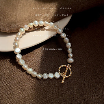 Irregular White Pearl Bracelet With Gold Tone Round Toggle Clasp