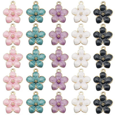 Gold-tone cherry blossom charms arranged on a light background