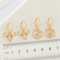 Gold Tone Crystal Animal Huggie Drop Earrings in Two Designs view 2