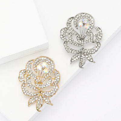 Front view of crystal rose flower brooch with iridescent center decorative metal pin