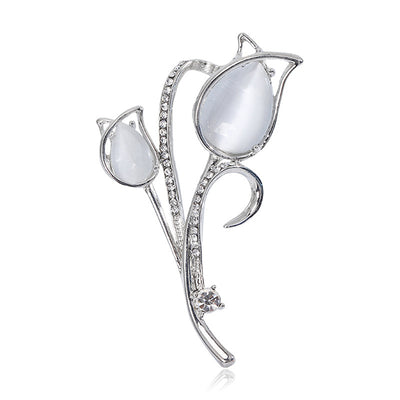 Front view of slender tulip stems with pale cat eye style petals and crystal edging