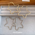 Large Open Star Hoop Earrings in Gold and Silver Tones view 4