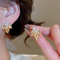Gold Tone Leaf Stud Earrings with Pearl Accents Jewelry Design view 1