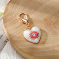 Gold Tone Evil Eye Heart Charms with Large Lobster Clasps in Six Designs view 6