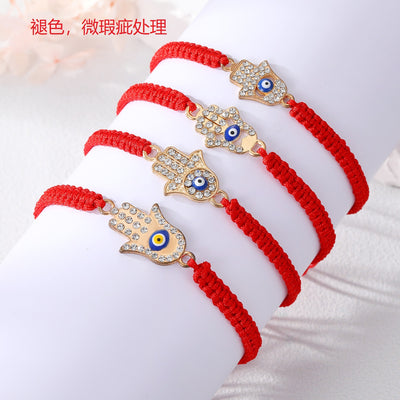 Main product view of gold Tone Crystal Hamsa Blue Evil Eye Red Cord Bracelets in Four Designs