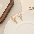 Gold Tone Crescent Moon and Star Chain Tassel Earrings view 2