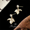 Gold Tone White Pearl Top And Three Petal Flower Drop Stud Earrings view 3