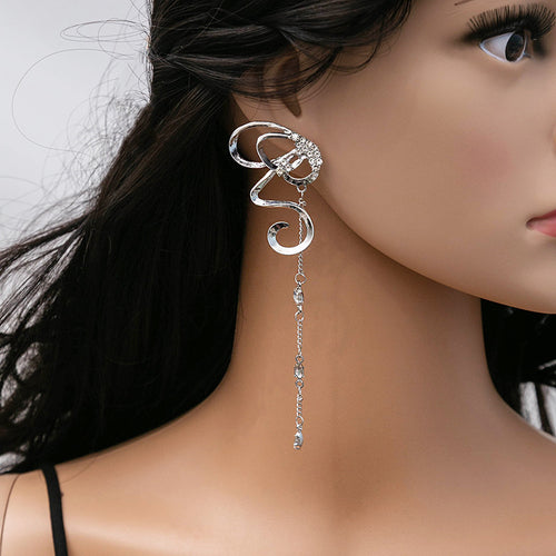 Silver butterfly ribbon drop earring worn on a mannequin ear side view