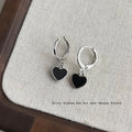 Silver Huggie Hoop Earrings With Black Heart Charm view 3
