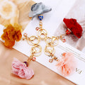 Fabric Flower and Tassel Keychains in Five Pictured Colors view 2