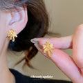 Gold Firework Burst Pendant Necklace and Matching Stud Earrings view 4