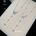 Butterfly and Pearl Drop Necklaces in Gold and Silver Tone view 1