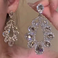 Silver Crystal Teardrop Cluster Stud Earrings with Polished Metal Details view 1