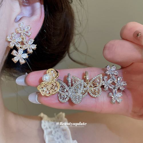 Display view of crystal flower and butterfly ear clips